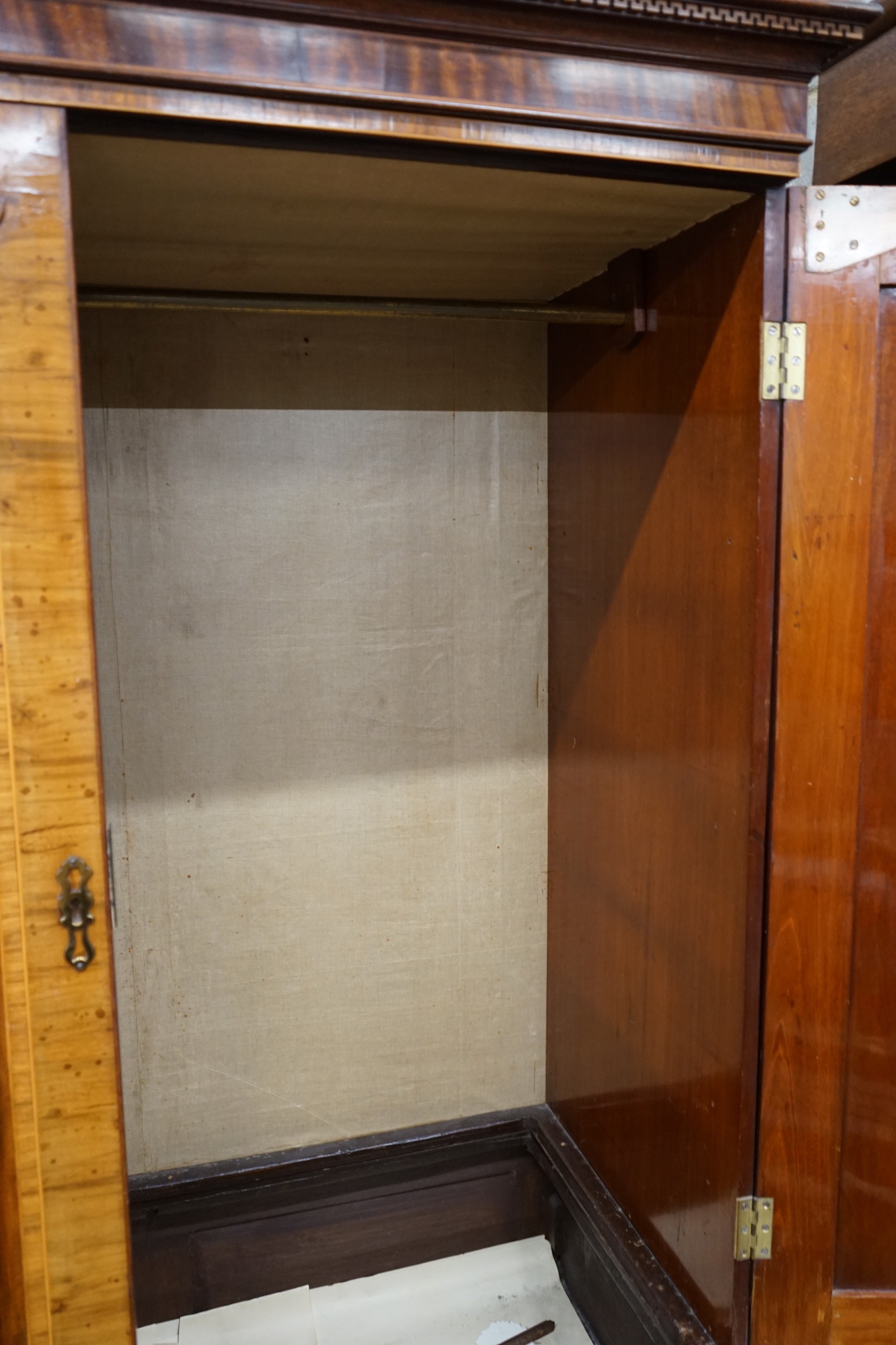 A George III banded mahogany hanging cupboard, width 123cm, depth 59cm, height 196cm
